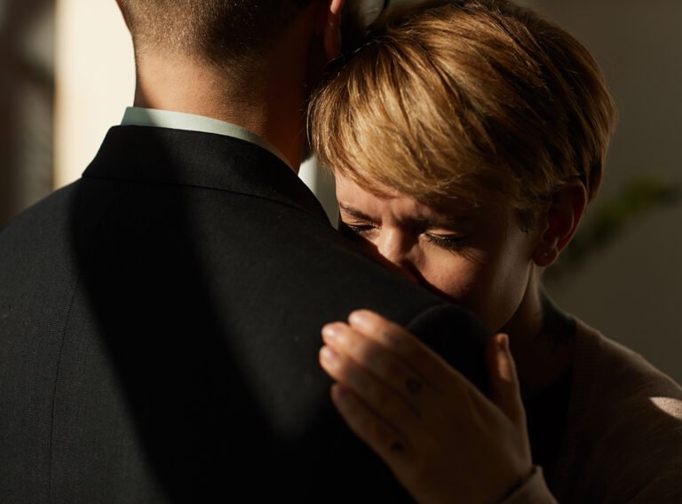 Man supporting the woman Sad woman embracing the man and he supporting her in difficult situation